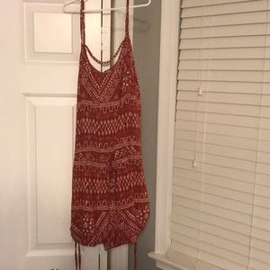 orange and white patterned garage romper